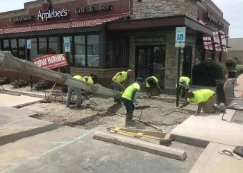 Sipes Asphalt & Concrete performing paving services on site