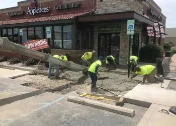 Sipes Asphalt & Concrete performing paving services on site